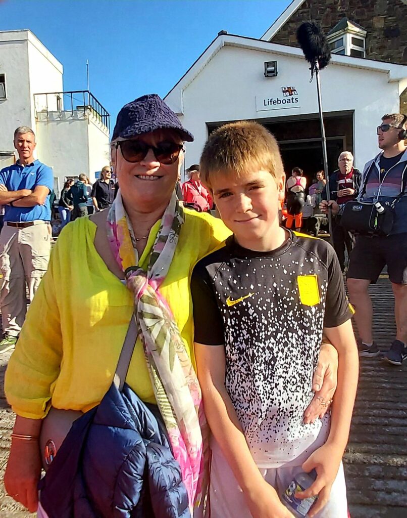 Siobhan Harrison with her grand nephew Darragh O Droma at the RNLI Helvick Swim. (Joan Clancy)