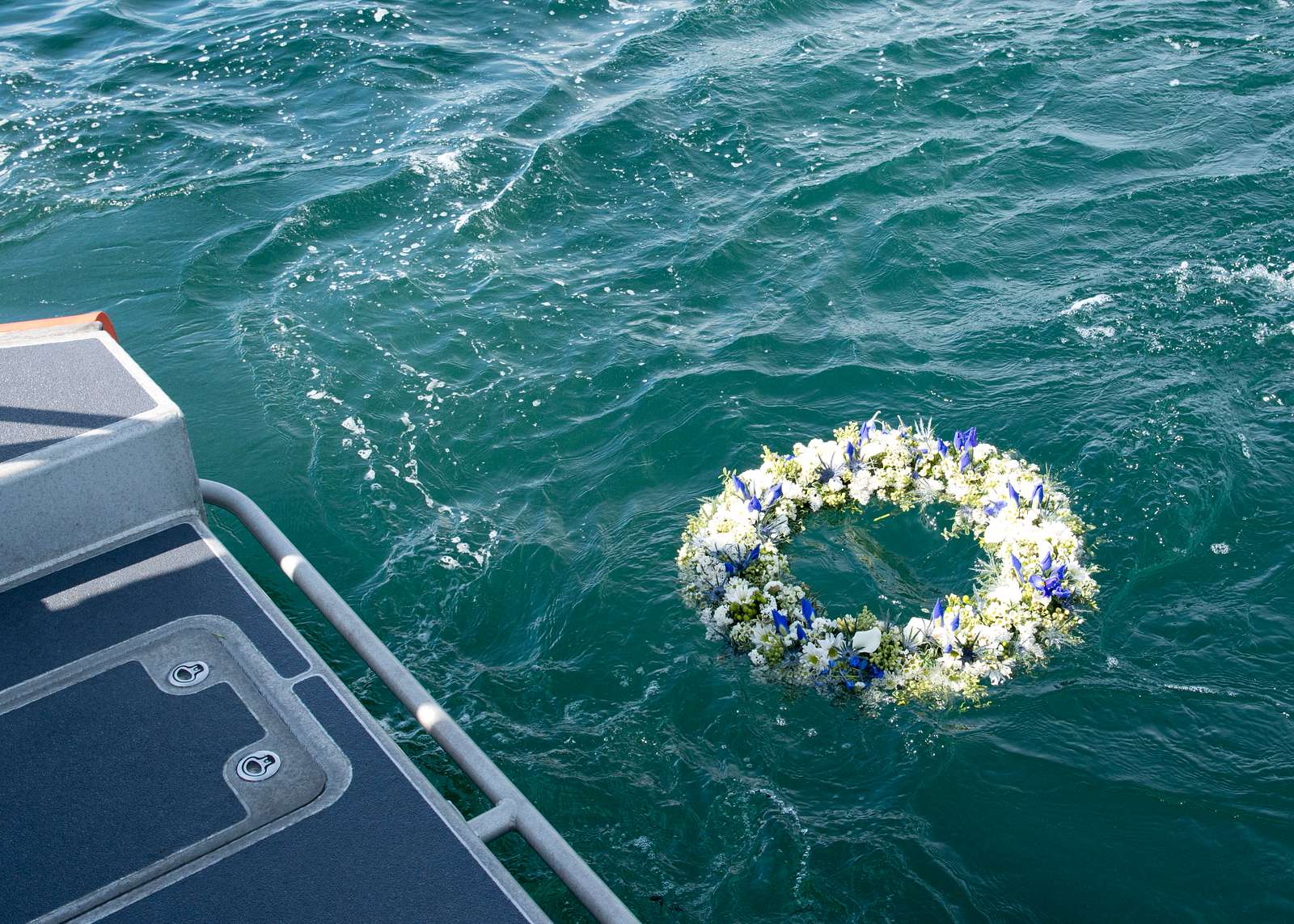 A wreath is laid during a memorial service